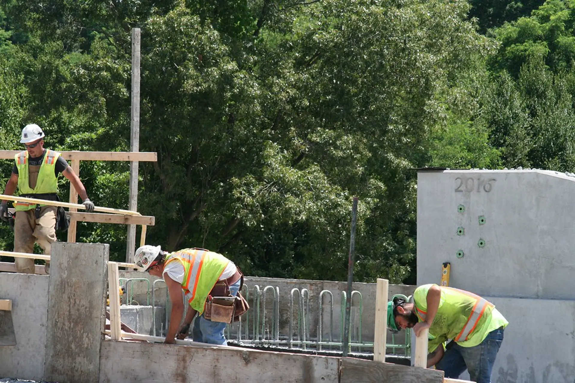 Binghamton Concrete Co crew setting precast concrete units on a job site in Binghamton, NY