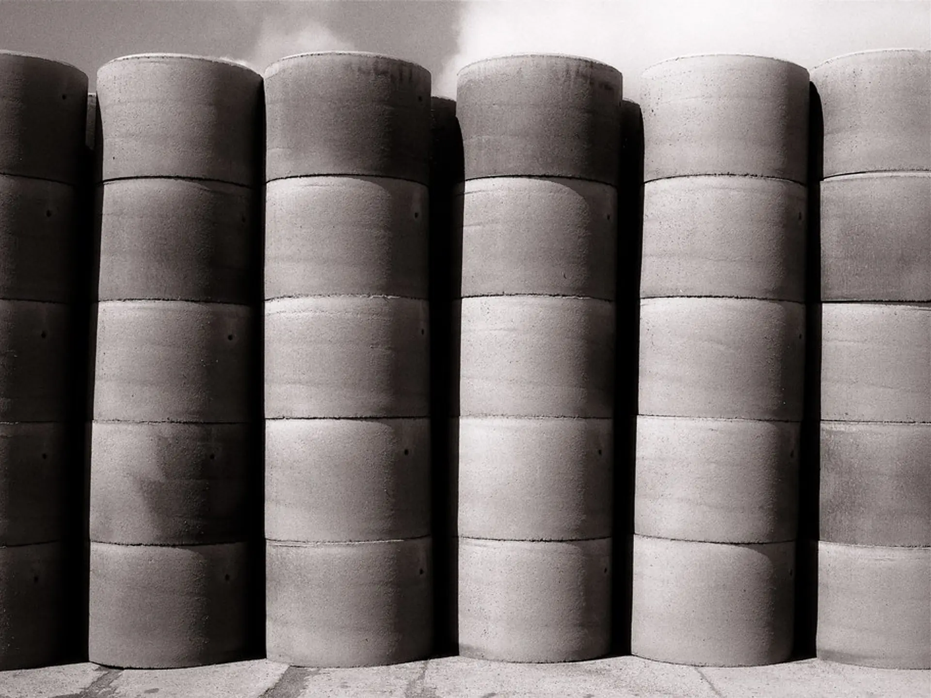 Precast concrete manhole and pipe sections stacked in the yard for delivery to Johnson City, NY