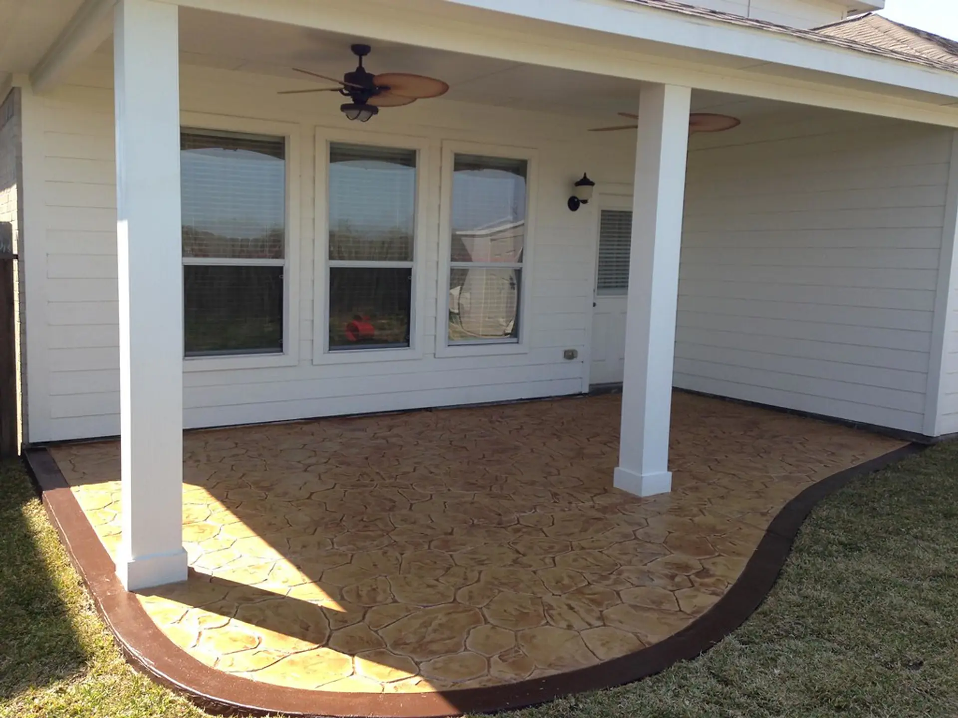 Finished concrete patio with decorative border on a home in Binghamton, NY